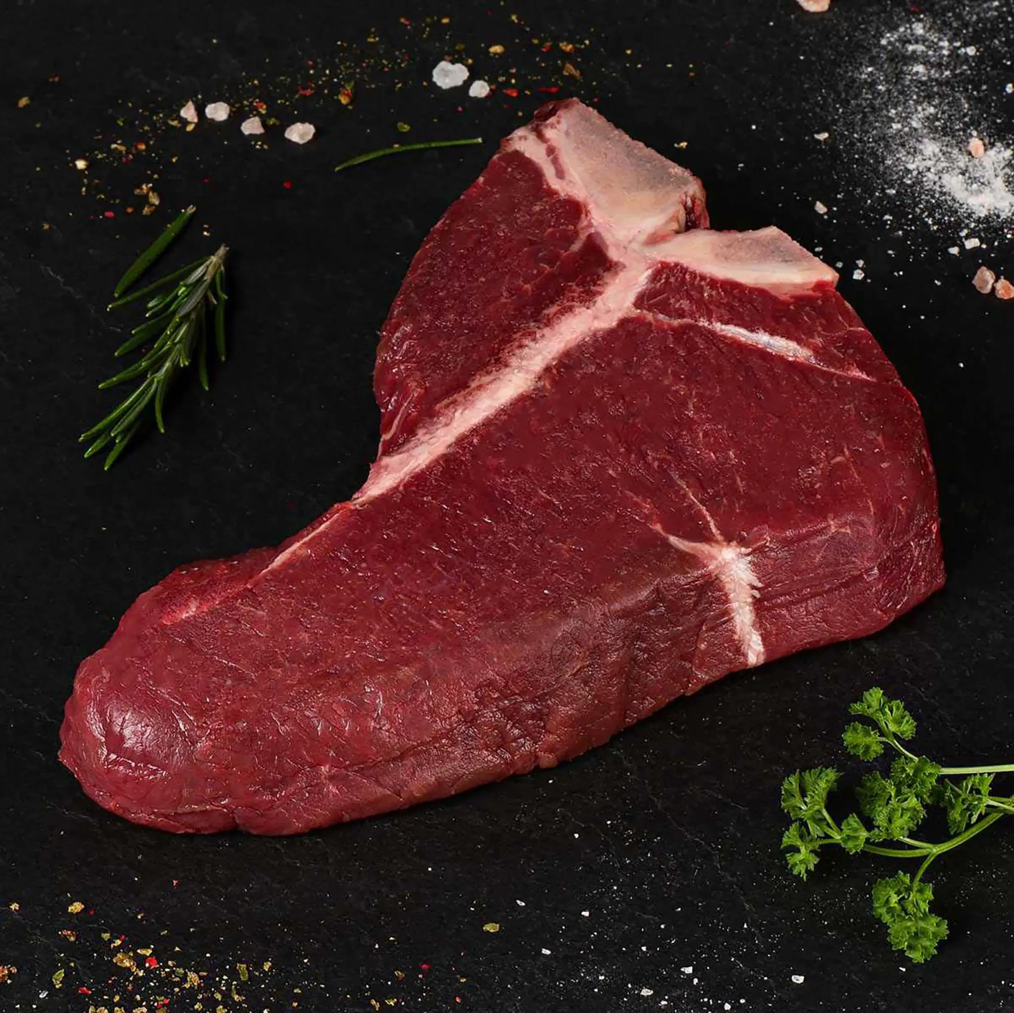Man sieht ein 600-Gramm-Dry-Aged-T-Bone-Steak, das man bei Kauf dein Steak kaufen kann
